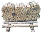 Storing firewood bundles on pieces of wood
