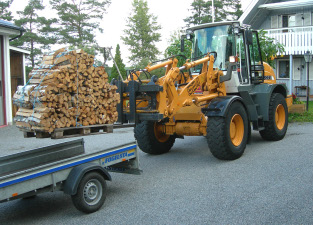 Loading firewood on trailer