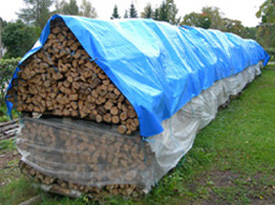 Storing firewood under tarpaulins